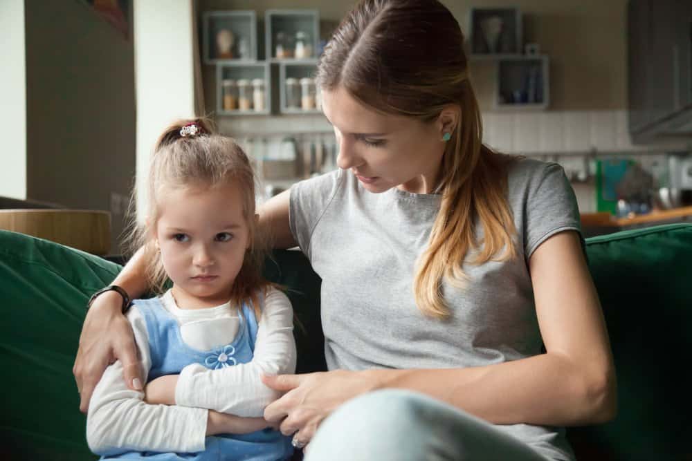 a mother calming explaining her daughter