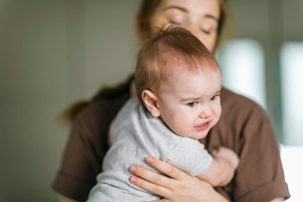 baby suffering from teething pain