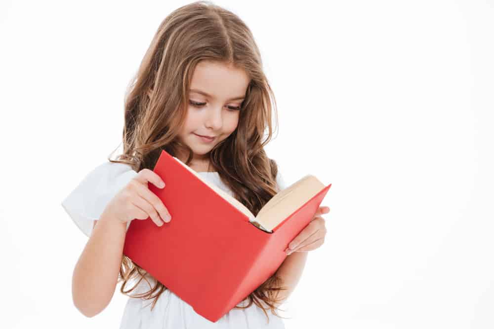 little girl reading book