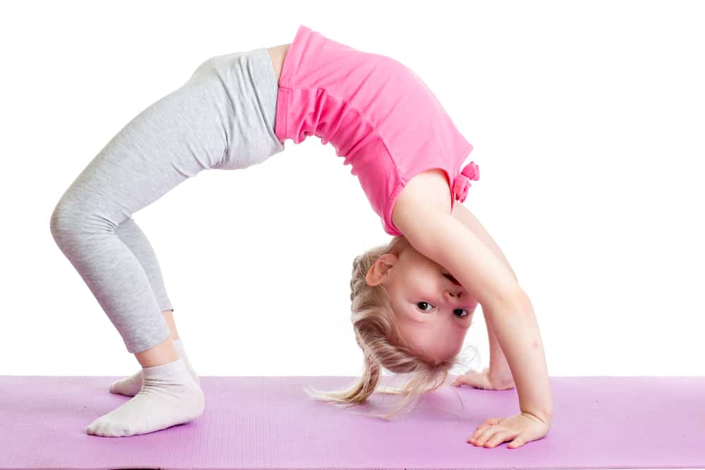 young girl doing back stretch