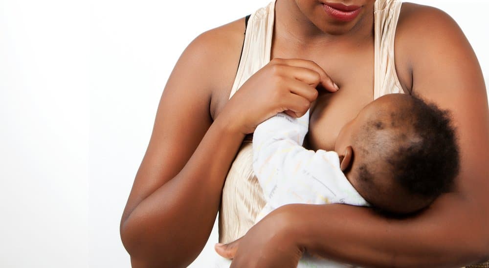 young mother breastfeeding her baby