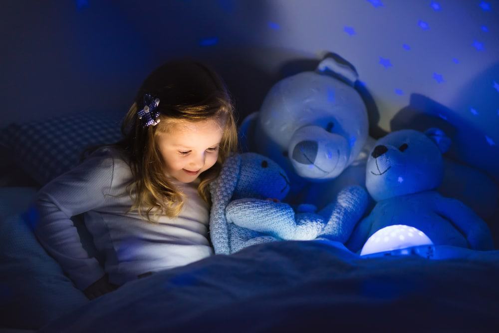 child reading by night light