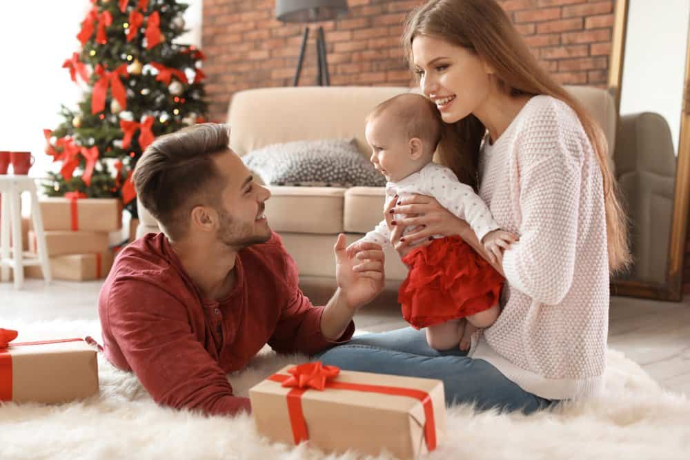 couple celebrating Christmas with baby