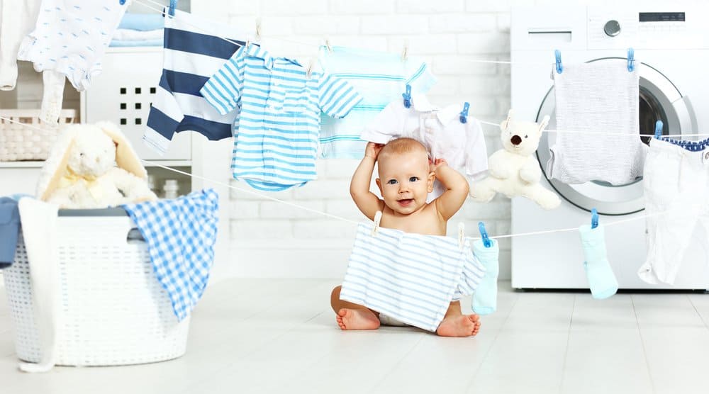 cute baby boy in laundry room