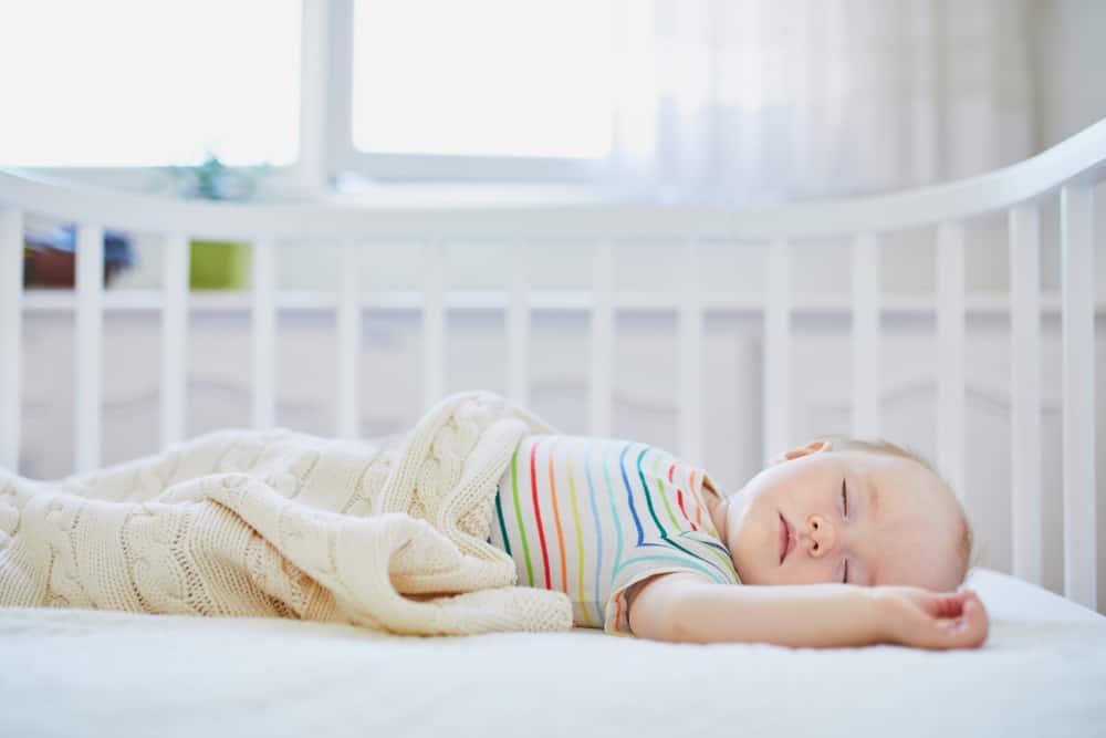 baby sleeping in a crib