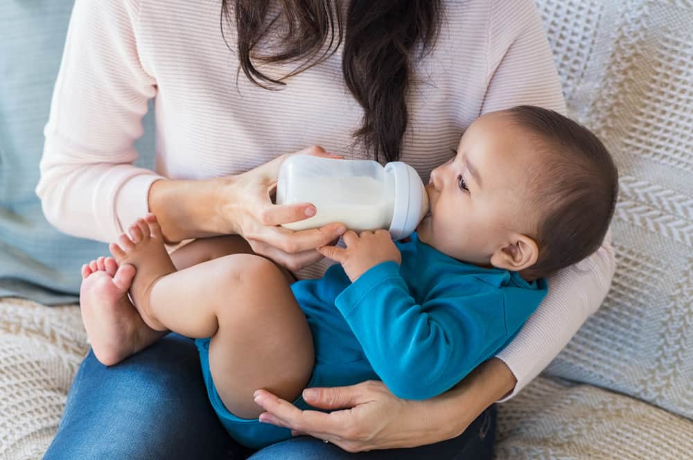 little baby being bottle-fed