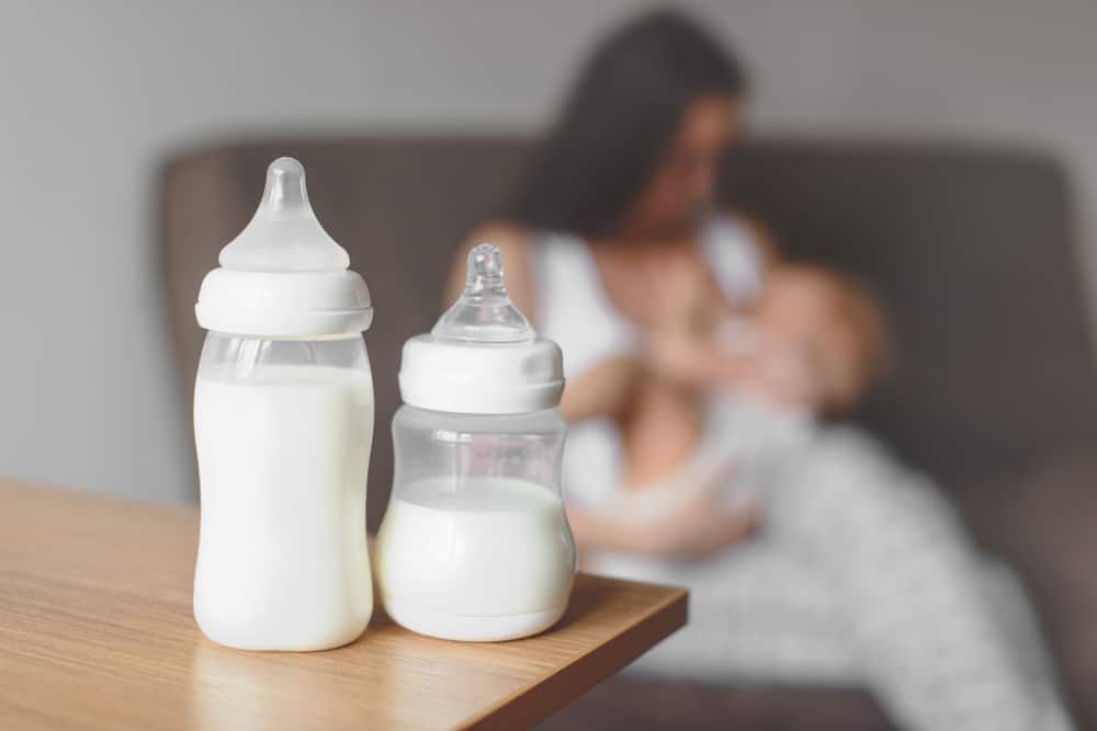 Mom bottle feeding her baby