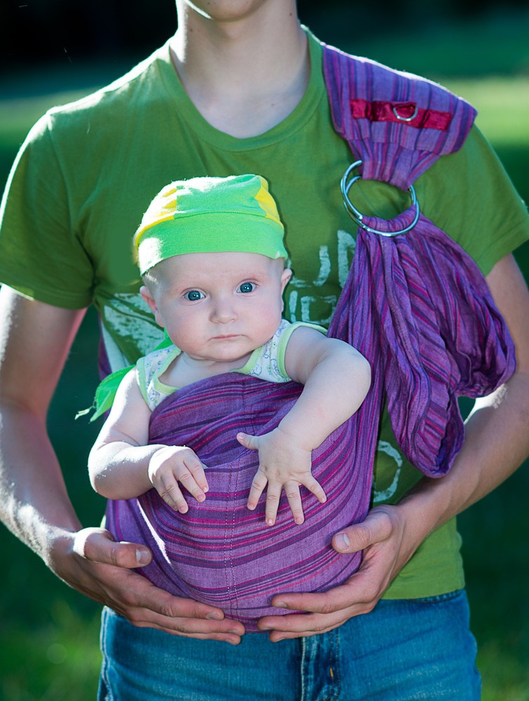 man holding baby in ring sling