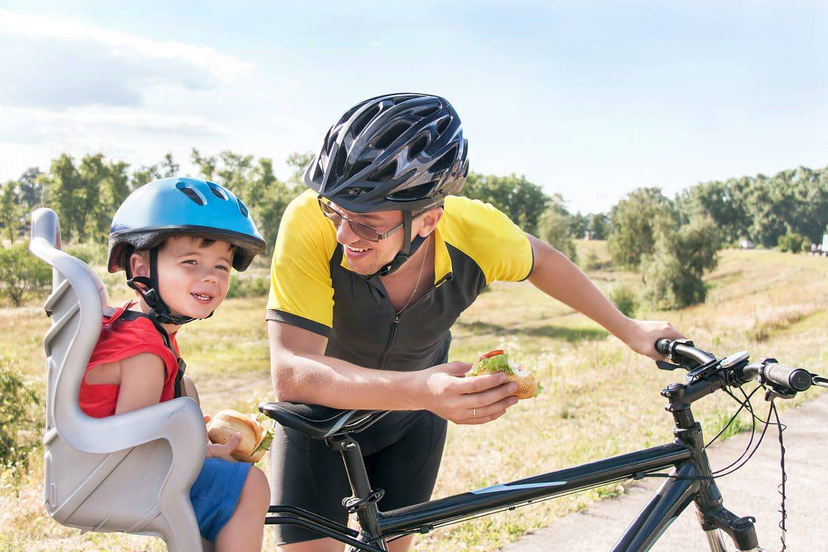 toddler on bike trailer