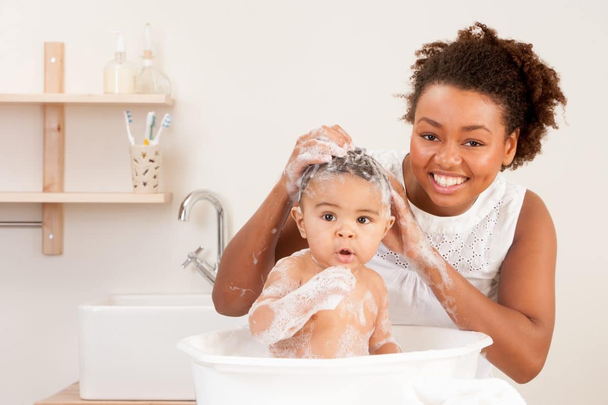 mom giving baby a bubble bath